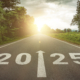 A graphic representing the year 2025 with the year painted onto a road.