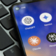 Photo of smart phone home screen with app icons for ChatGPT, Gemini, Copilot, Claude and Perplexity